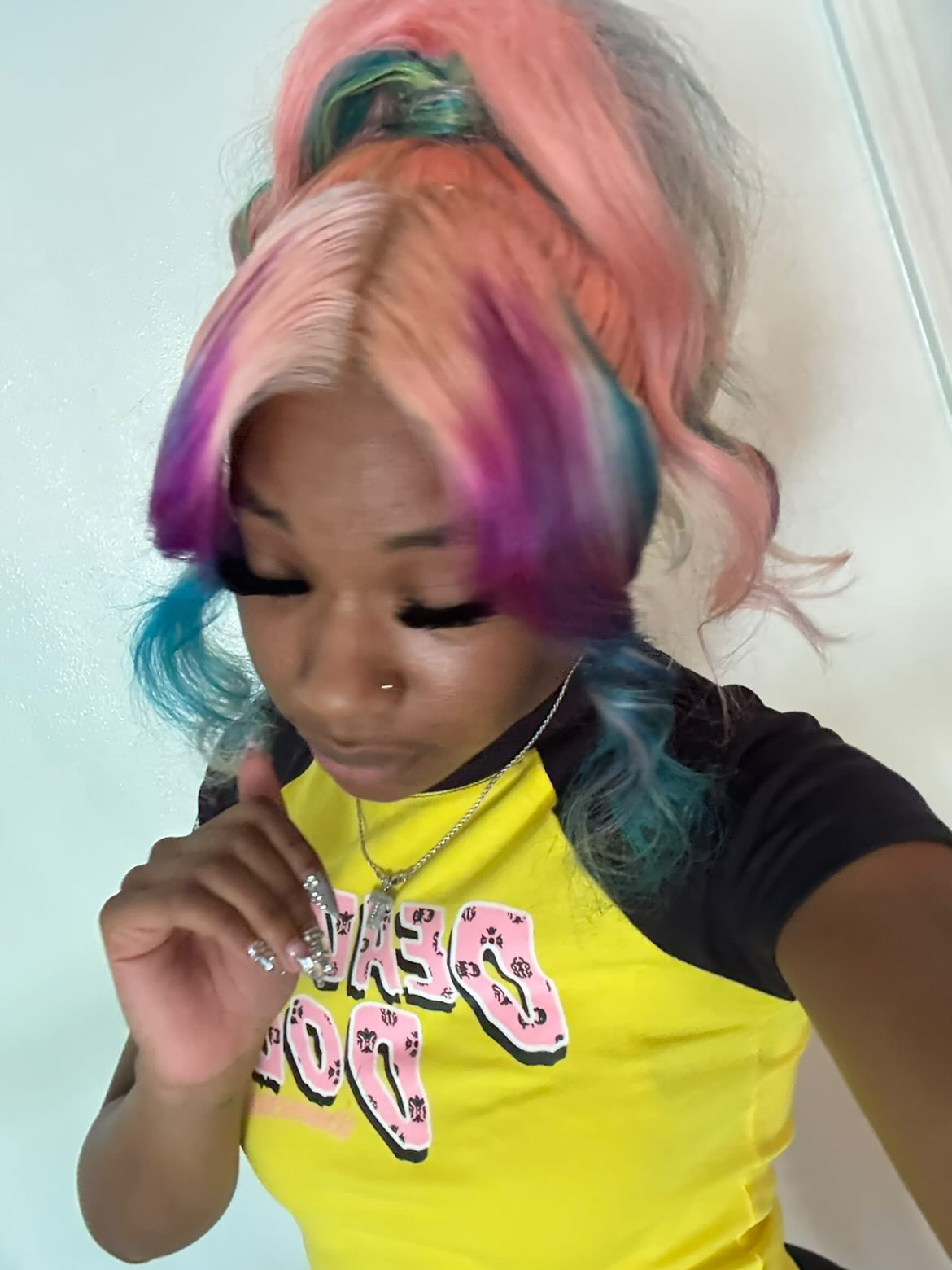 Jade rocking a pink and blue colored wig install